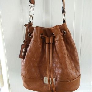 Tignanella Pebble leather bucket style crossbody purse